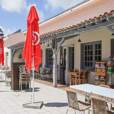 Mobile In Jean Near Sea