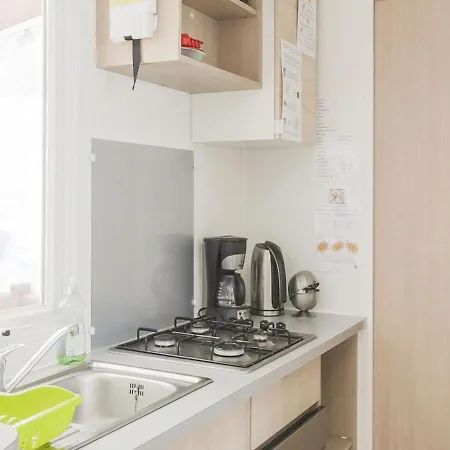 Mobile In Jean Near Sea