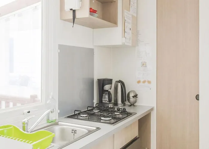 Mobile In Jean Near Sea