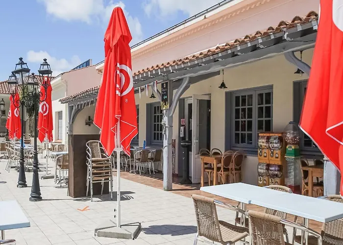 Mobile In Jean Near Sea